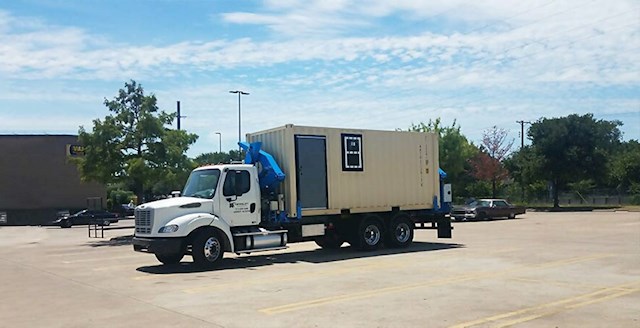 Self-loading truck containerized office